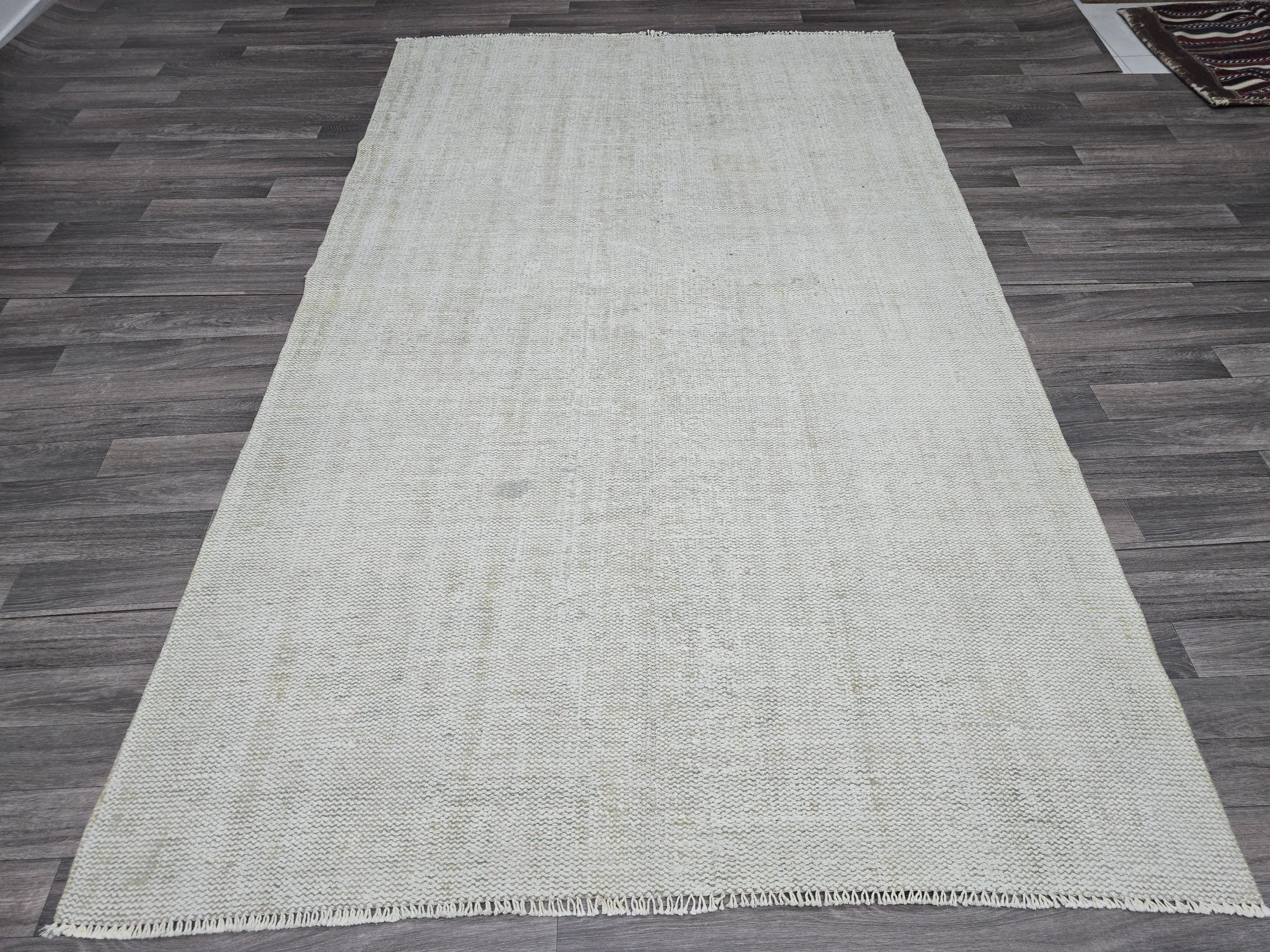 Vintage Handwoven Wool Rug: 5.4x8.6 ft Neutral Oushak Carpet