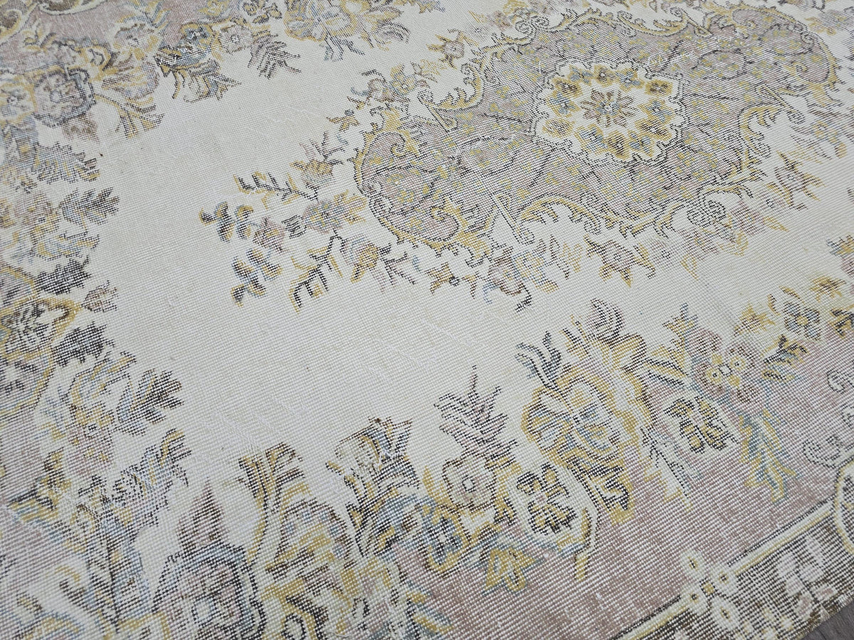 Hand Knotted Turkish Vintage Area Rug – 5.4x9 ft | Cream, Pink, Brown, Gold Accents