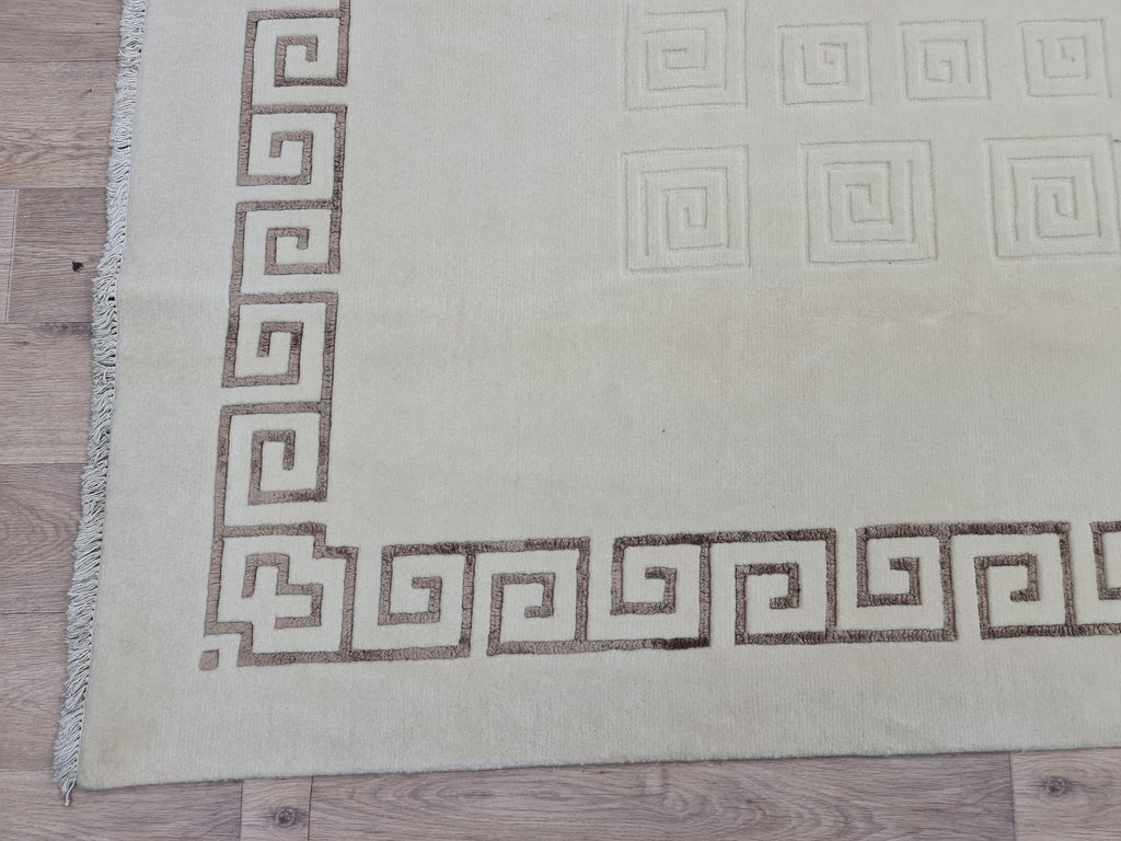 Cream Hand-Knotted Wool Area Rug: 6.82x9.35 ft, Vintage Boho Rug