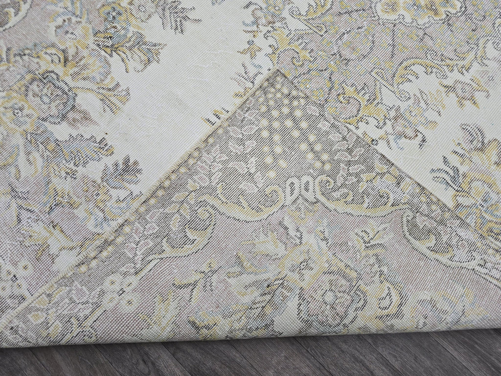 Hand Knotted Turkish Vintage Area Rug – 5.4x9 ft | Cream, Pink, Brown, Gold Accents