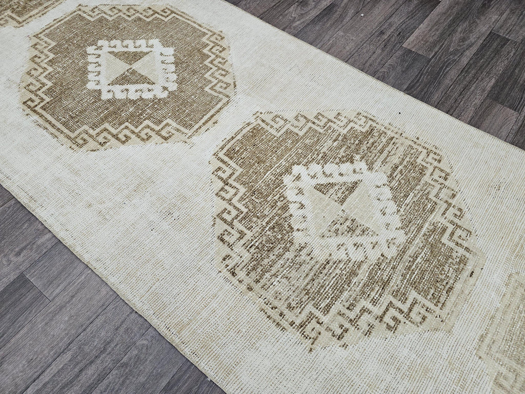 Vintage Hand-Knotted Wool Runner Rug: 3x10.5 ft Beige Brown Oriental