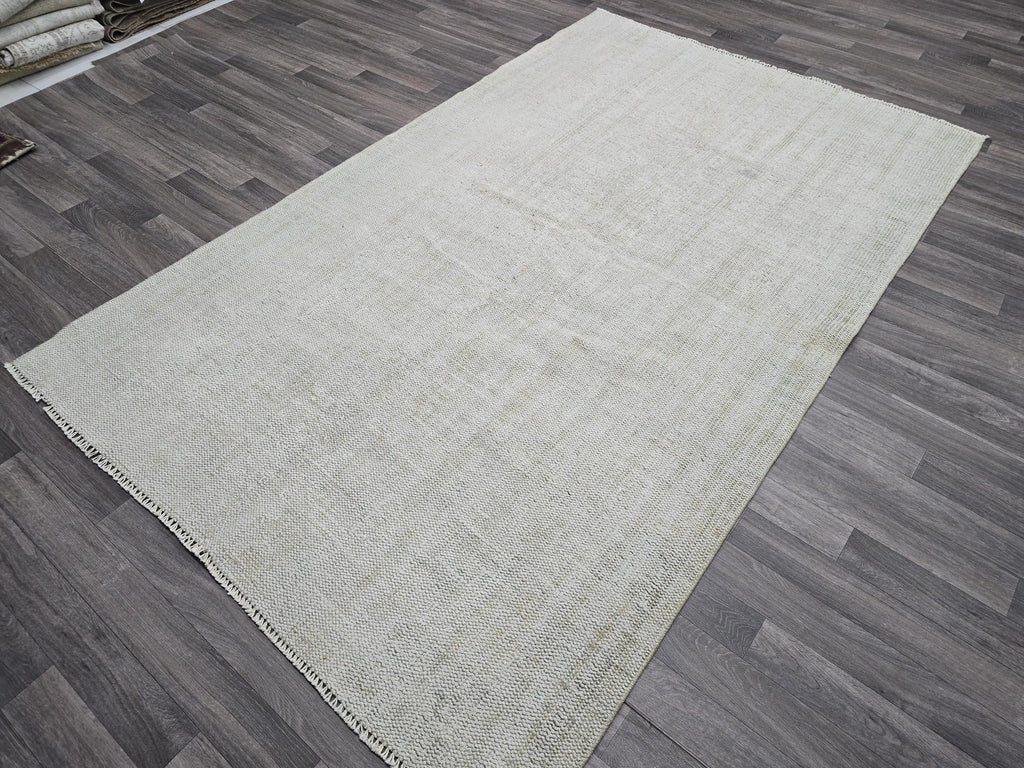 Vintage Handwoven Wool Rug: 5.4x8.6 ft Neutral Oushak Carpet