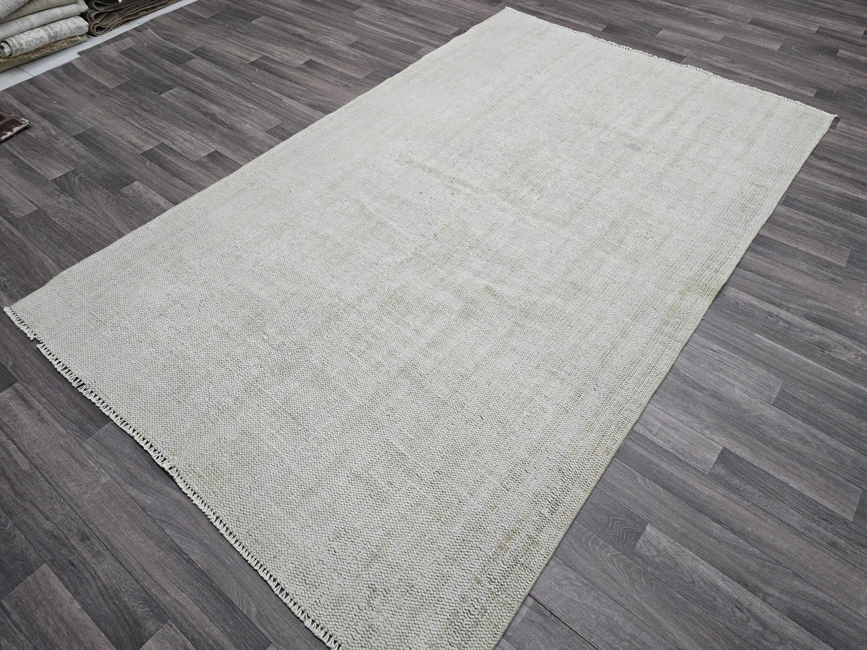 Vintage Handwoven Wool Rug: 5.4x8.6 ft Neutral Oushak Carpet