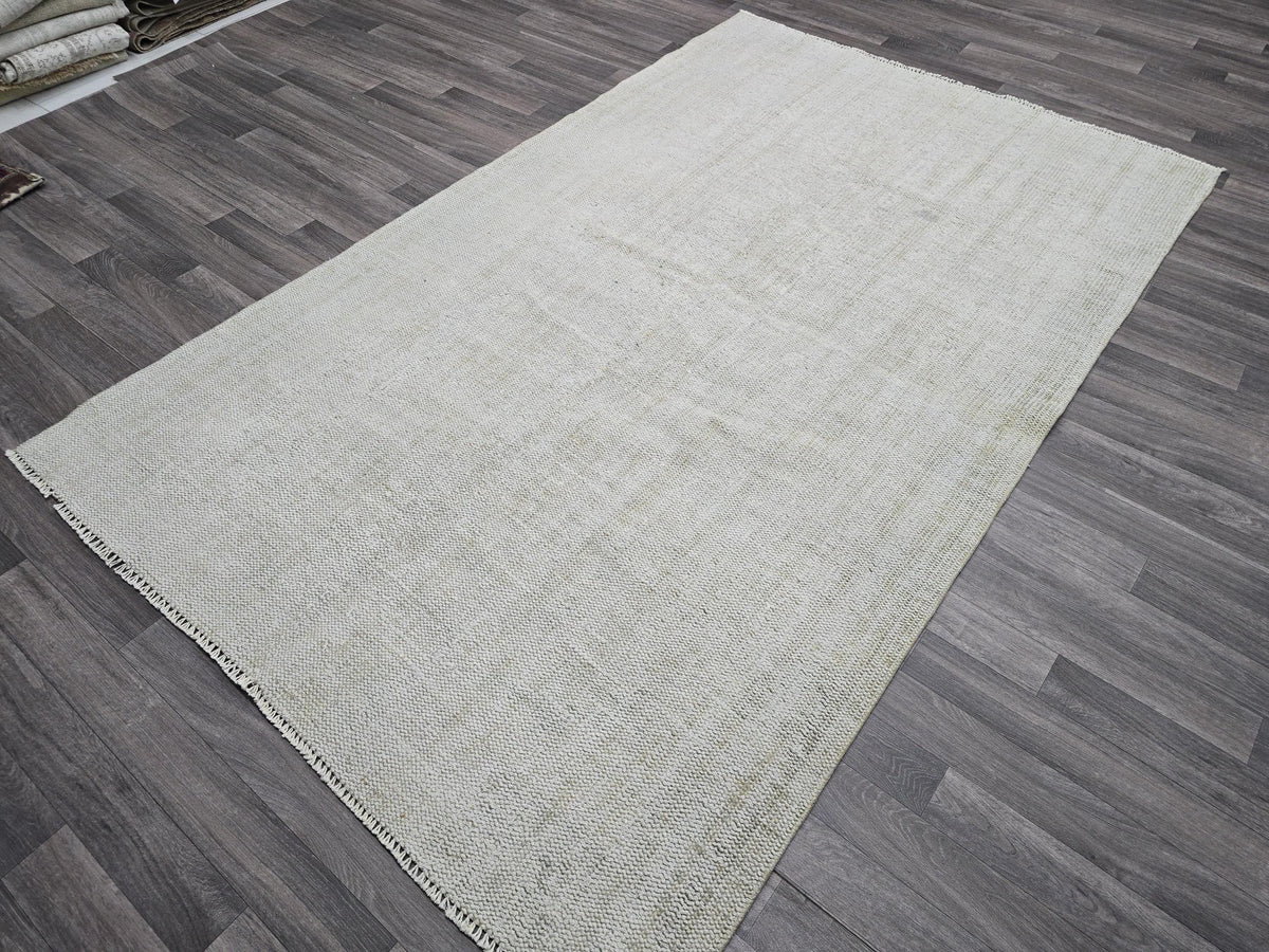 Vintage Handwoven Wool Rug: 5.4x8.6 ft Neutral Oushak Carpet