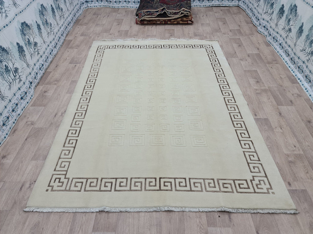 Cream Hand-Knotted Wool Area Rug: 6.82x9.35 ft, Vintage Boho Rug