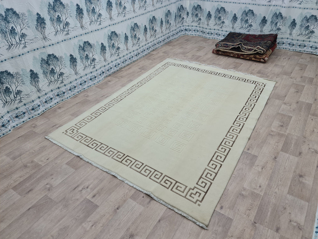 Cream Hand-Knotted Wool Area Rug: 6.82x9.35 ft, Vintage Boho Rug