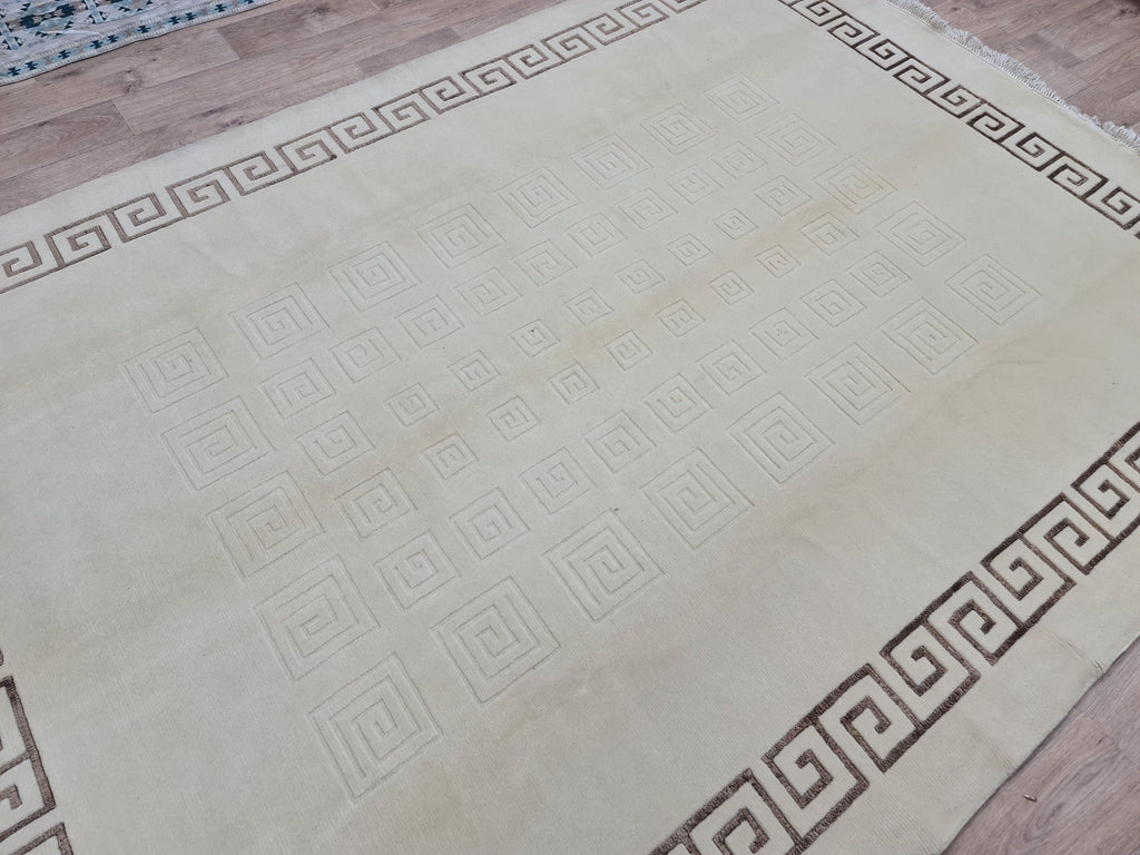 Cream Hand-Knotted Wool Area Rug: 6.82x9.35 ft, Vintage Boho Rug