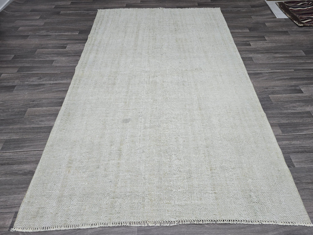 Vintage Handwoven Wool Rug: 5.4x8.6 ft Neutral Oushak Carpet