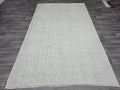 Vintage Handwoven Wool Rug: 5.4x8.6 ft Neutral Oushak Carpet